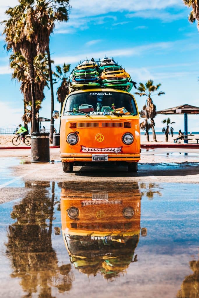 Van with surfboards strapped to roof