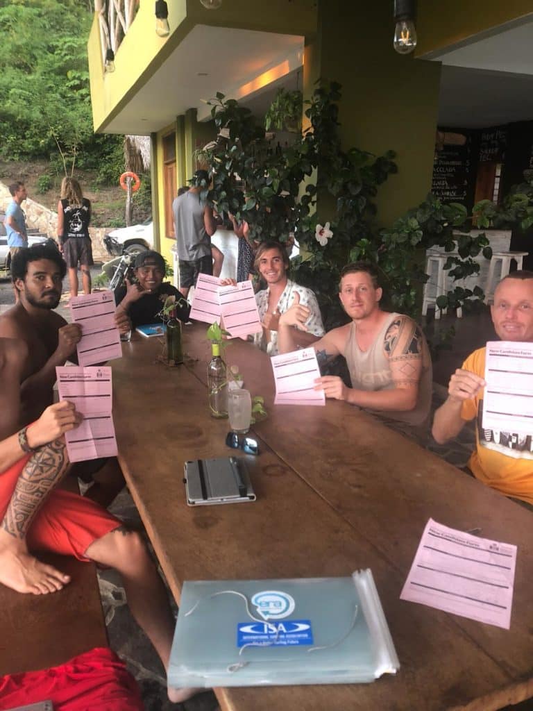 Guests holding up their surf coaching certificates