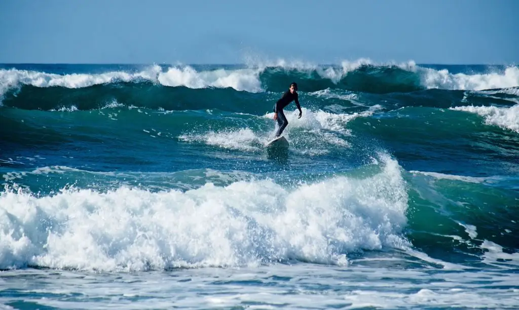 Offshore waves and a surfer riding them