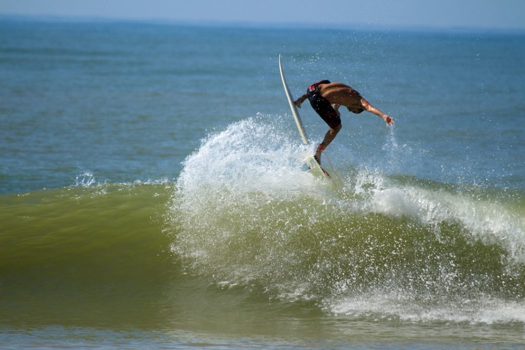 Surfer doing some tricks in the water