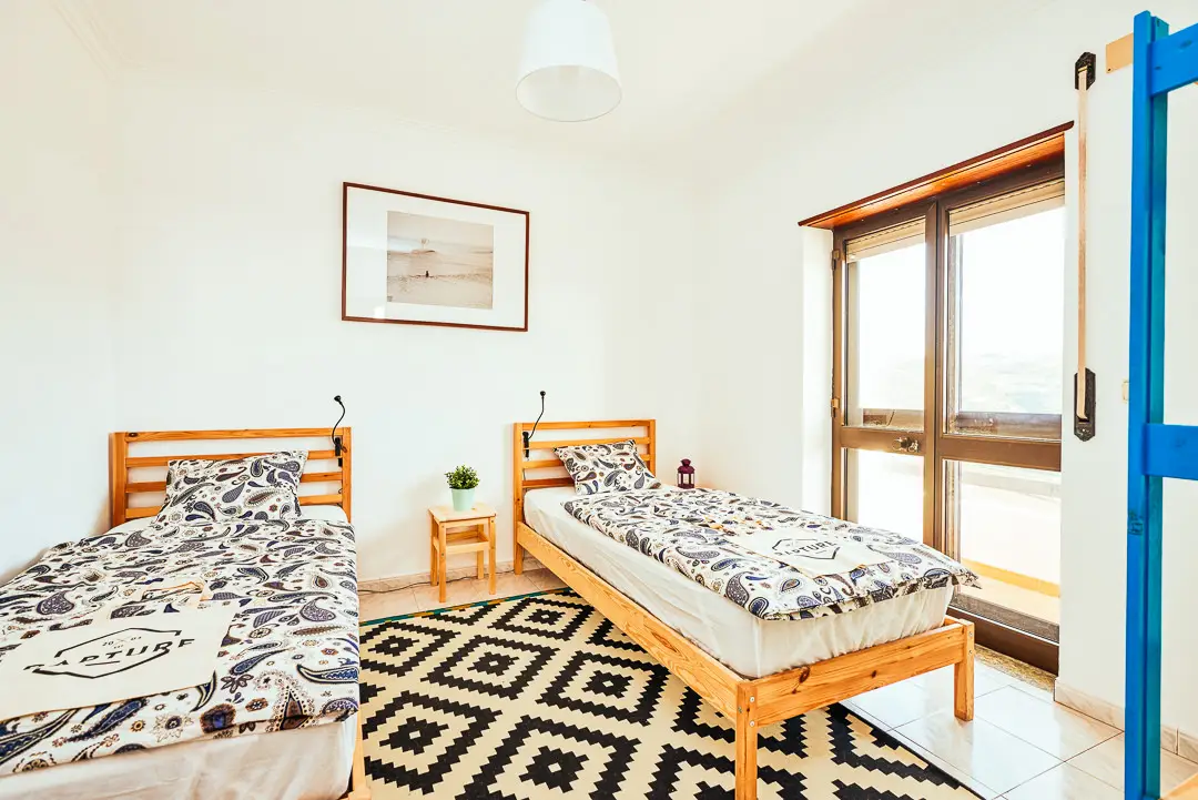 Two twin beds in a room with view at Rapturecamps Ericeira