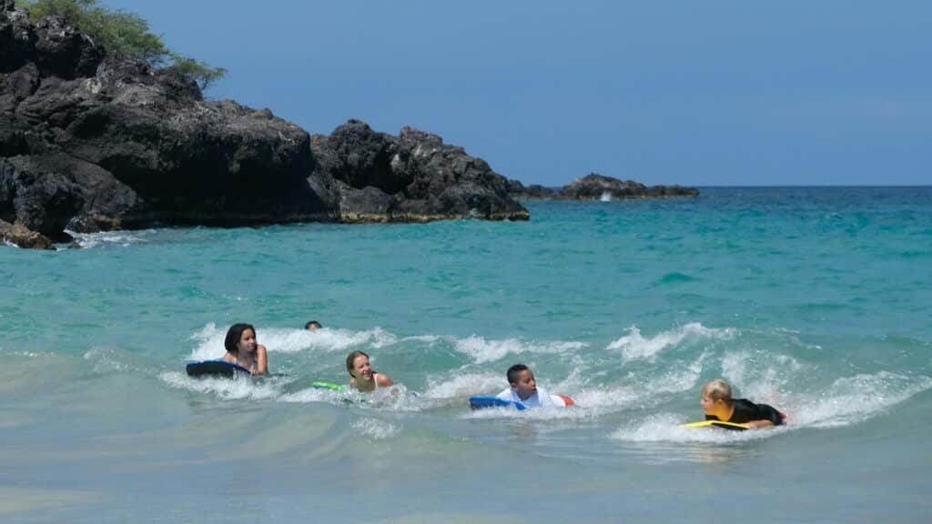 An image of children bodyboarding