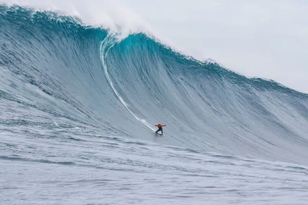 An image of a person surfing Cortes Bank Wave in Southern California, home of beaches with the biggest waves