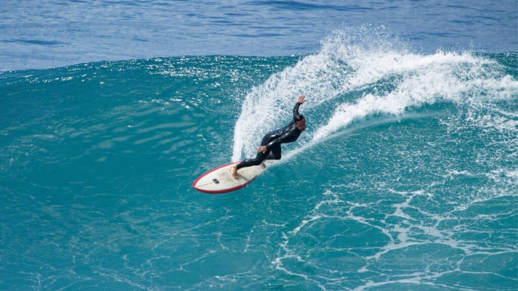 An image of a surfer going fast on a wave