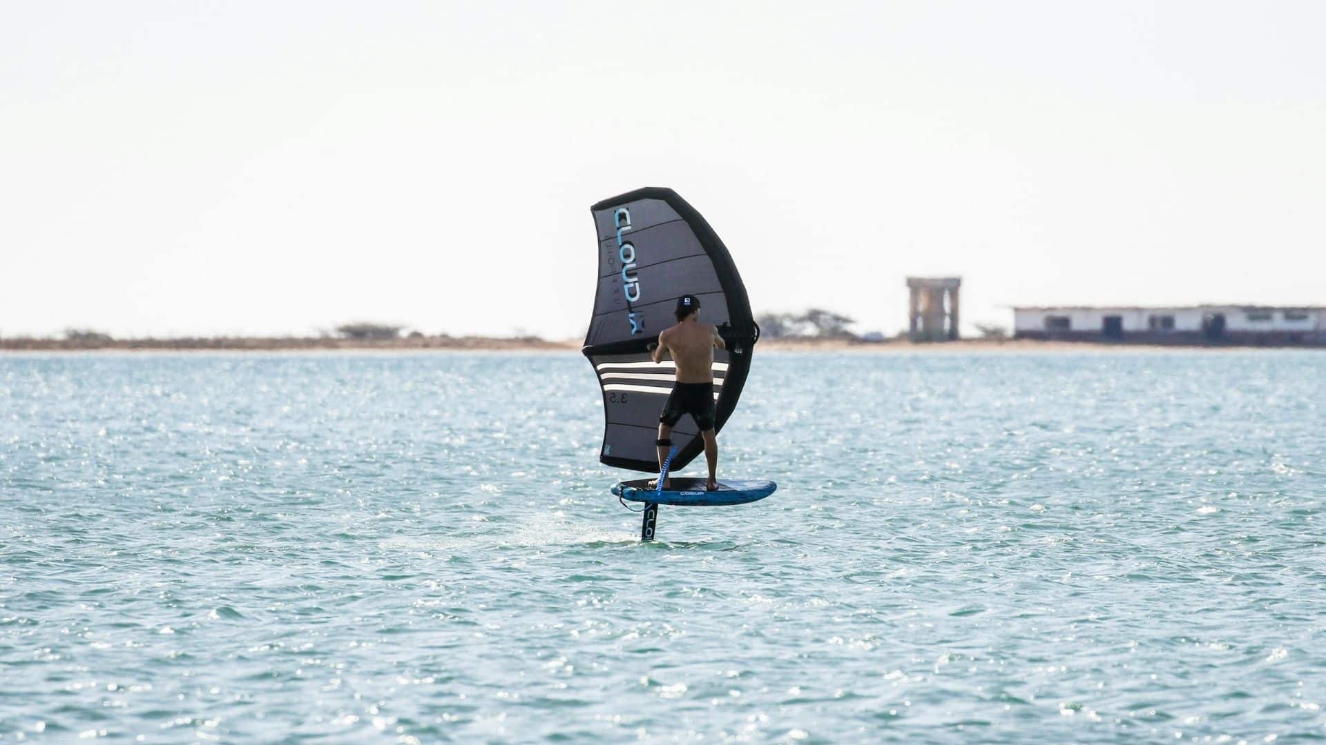 An image of foil surfing with a sail