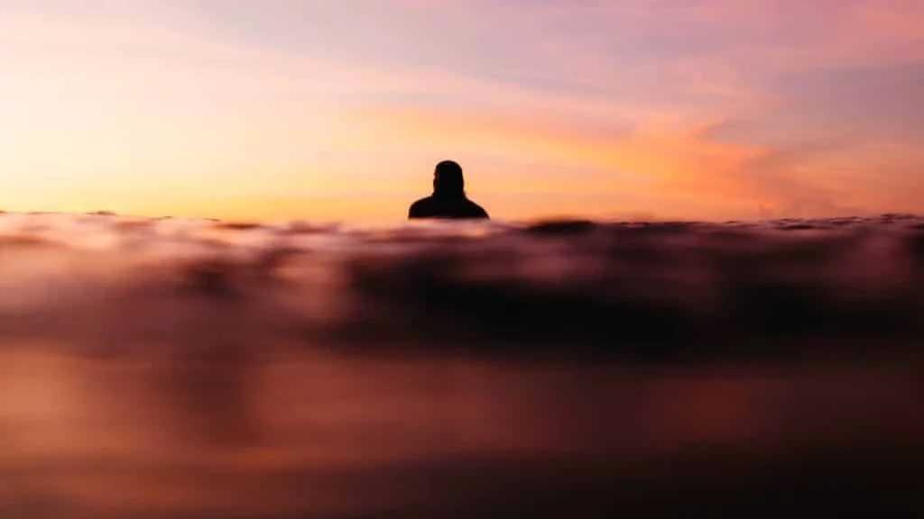 Early morning wave rider learning to surf in Bali