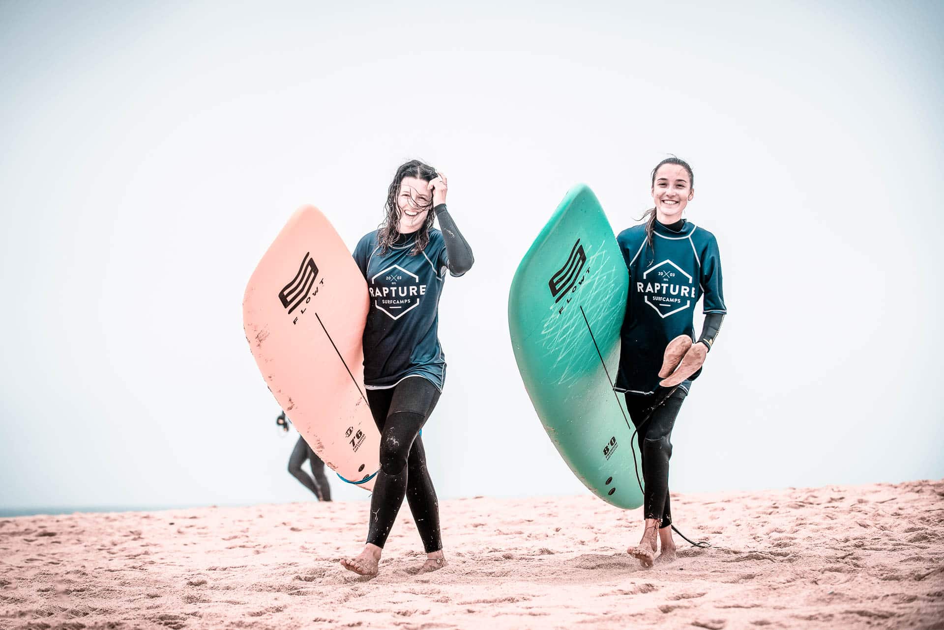 Grils-Walking-To-Surf