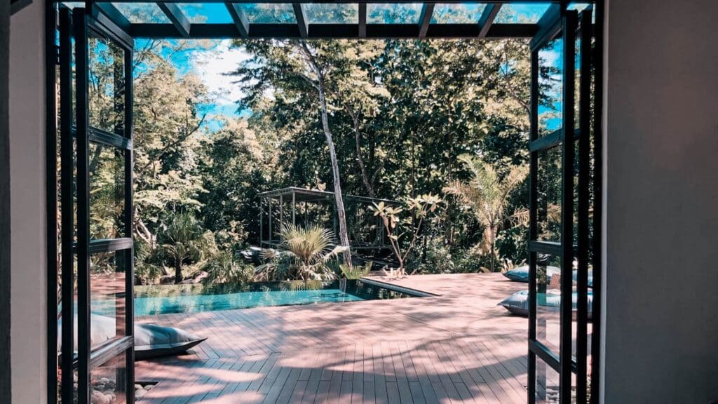 An image of a pool and trees at Rapture Surfcamps Costa Rica
