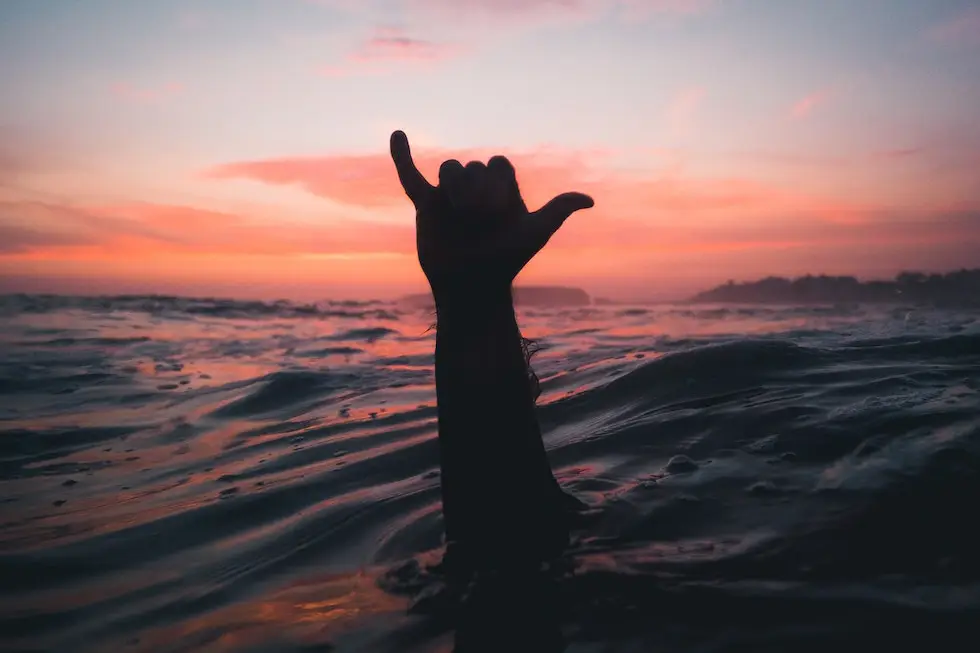 Surfer making a Shaka sign