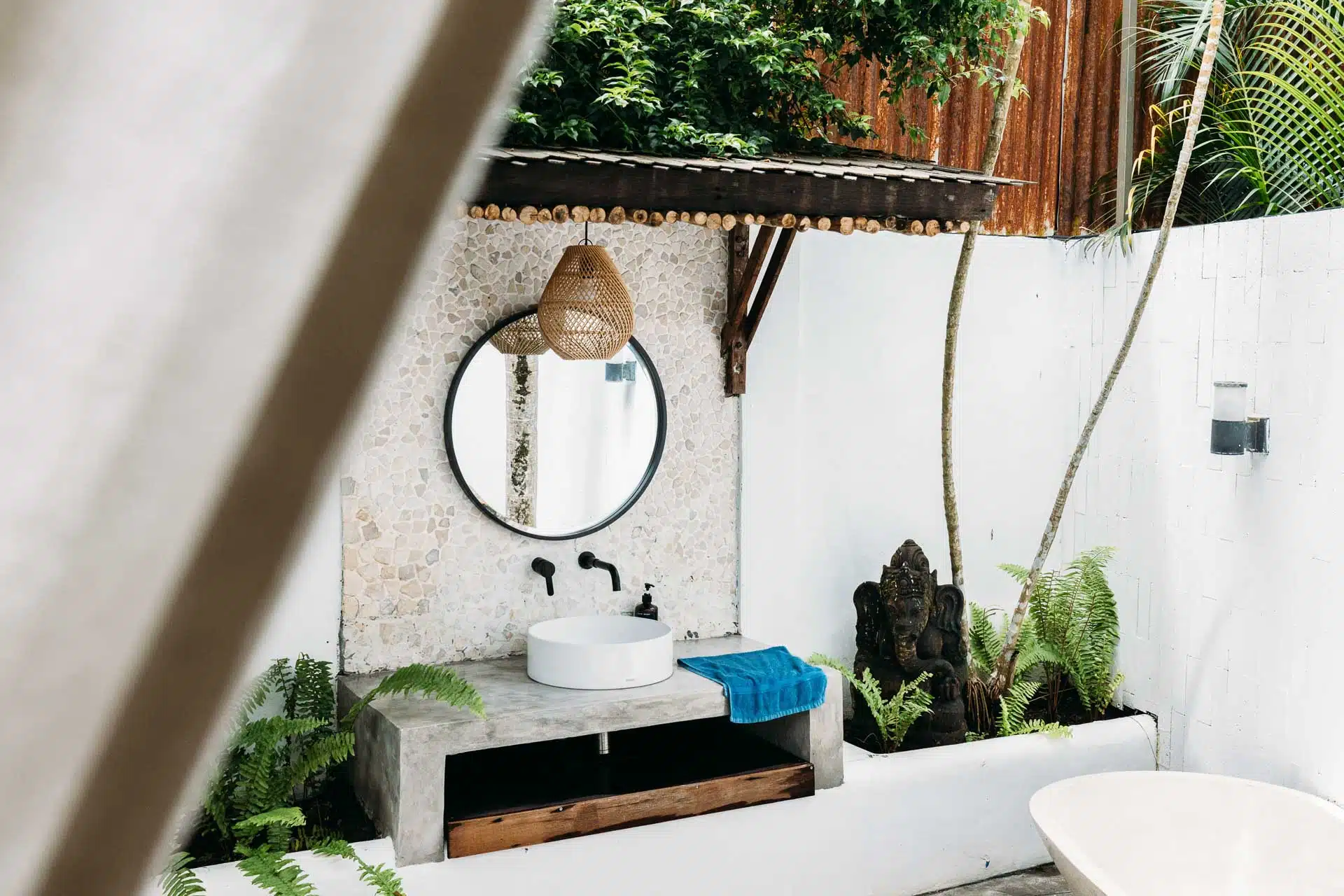 An outside bathroom sink with jungle motives