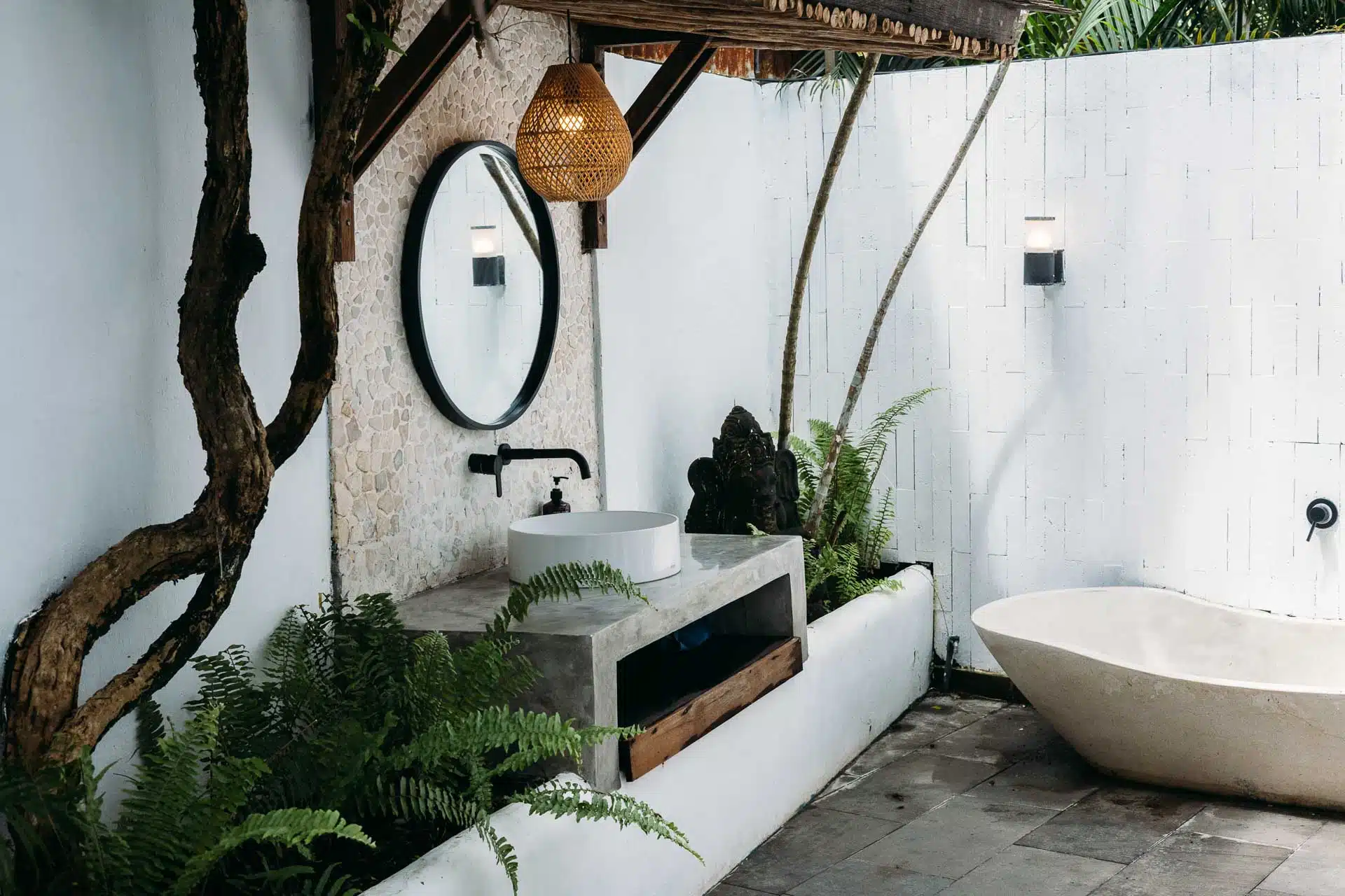An outside bathroom sink with mirror sideview