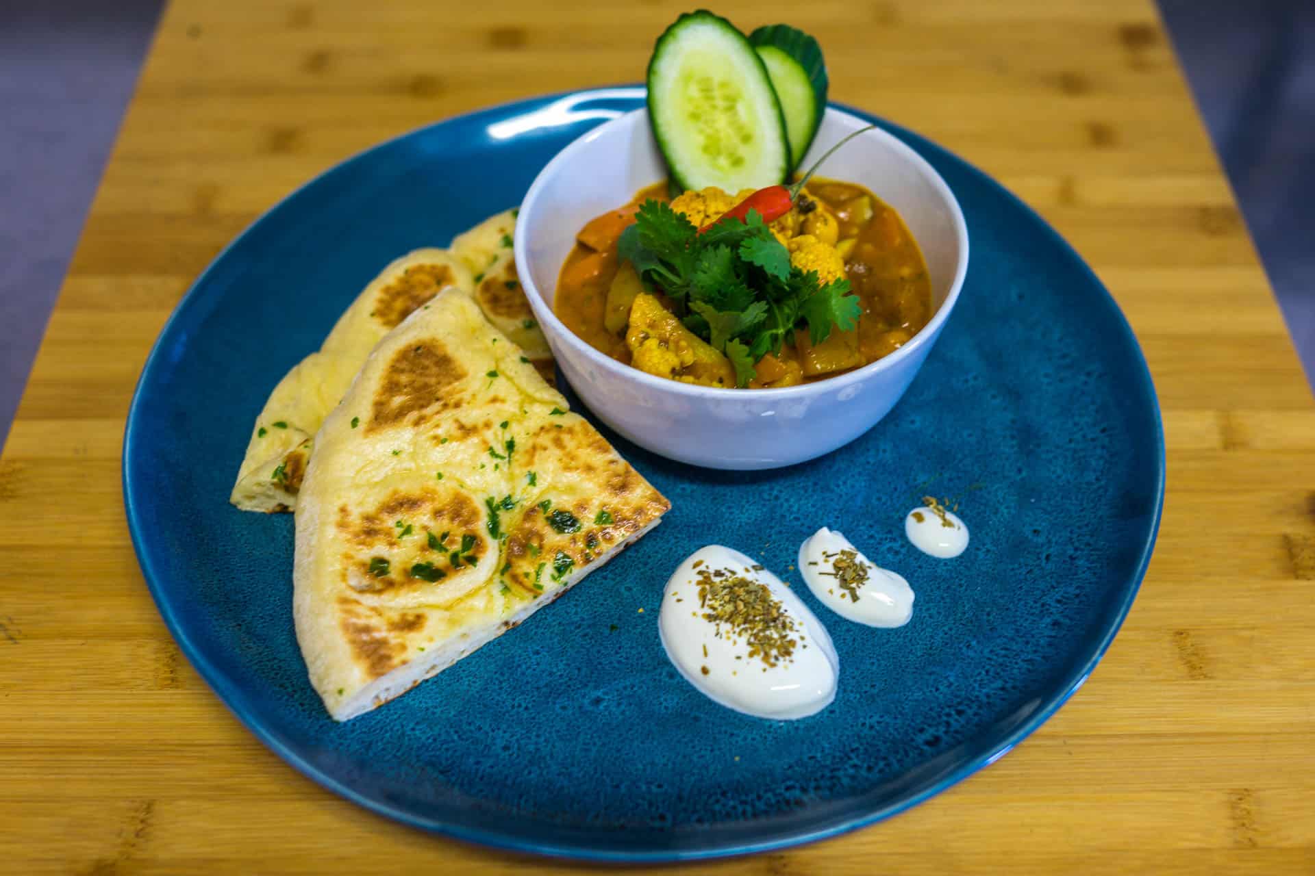 Veggie Curry on a blue plate