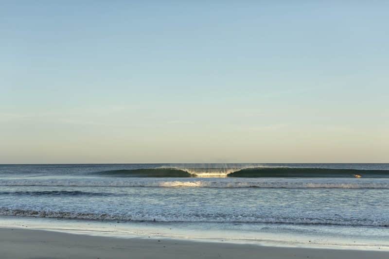 Breaking wave in front of our surf camp