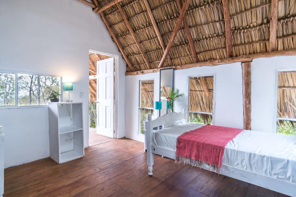A shared room with high roof for surfers