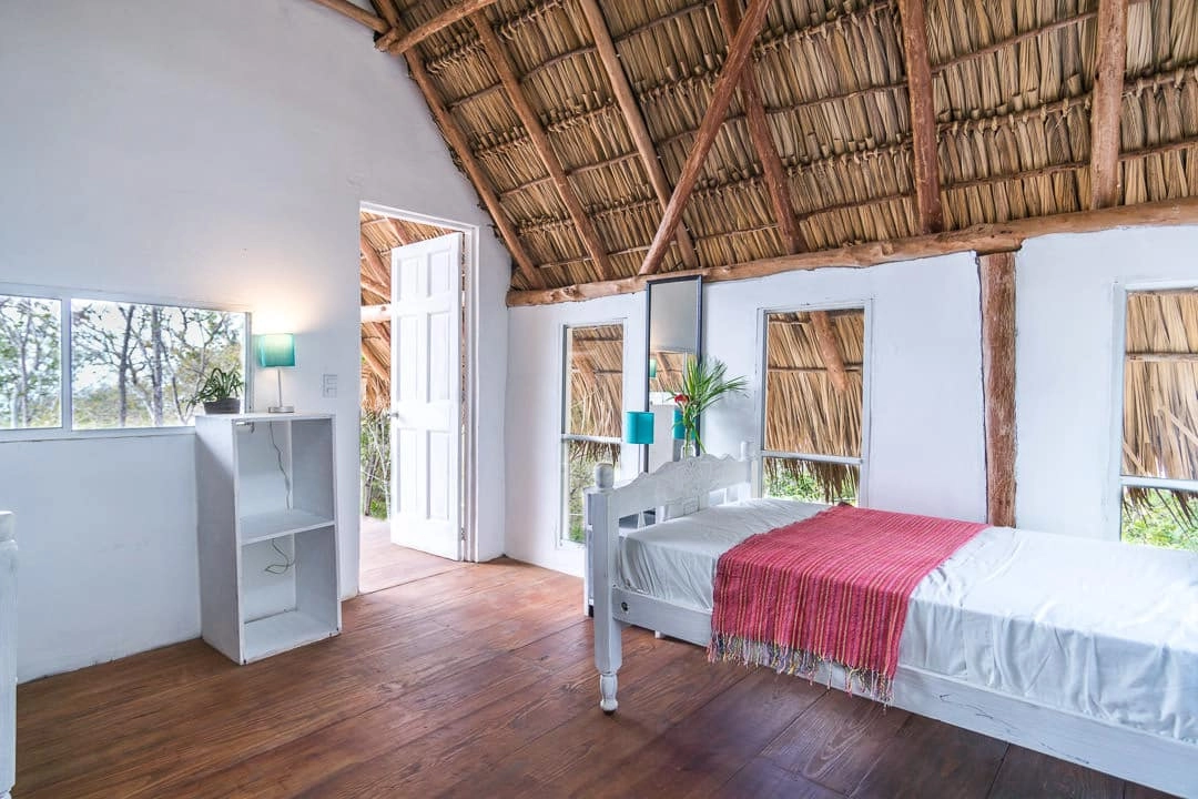 A shared room with high roof for surfers