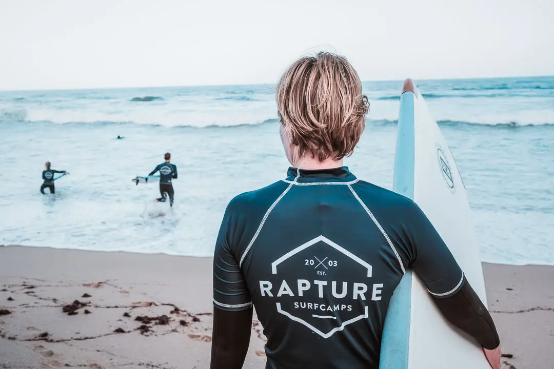 Rapturecamps Ericeira Sao Lourenco Surfer with surfboard
