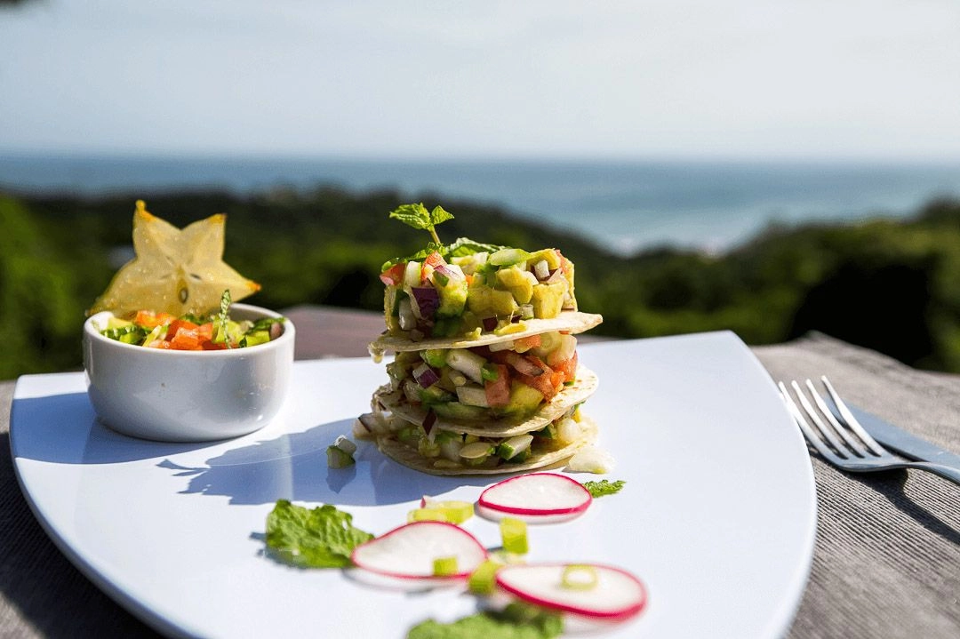 A colorful dish of tacos with vegetables