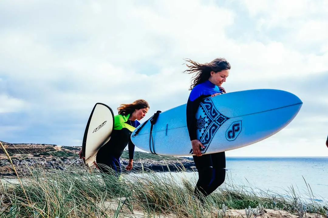 Surfers arriving to Ericeira beach