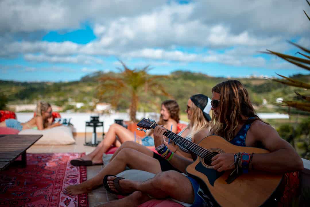People chilling on the roof of our surf camp in Ericeira