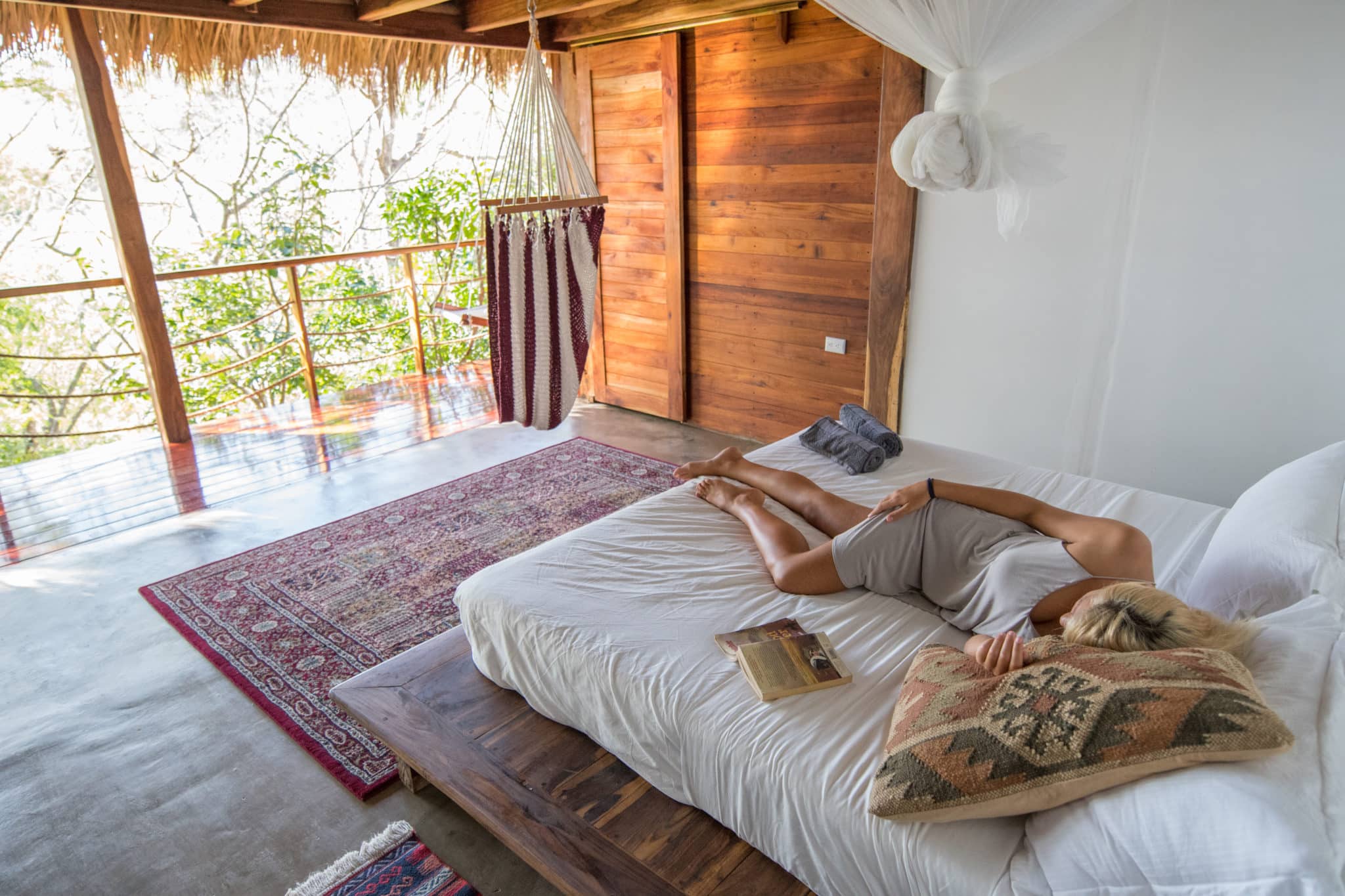 a woma sleeping in luxurious open spaced room