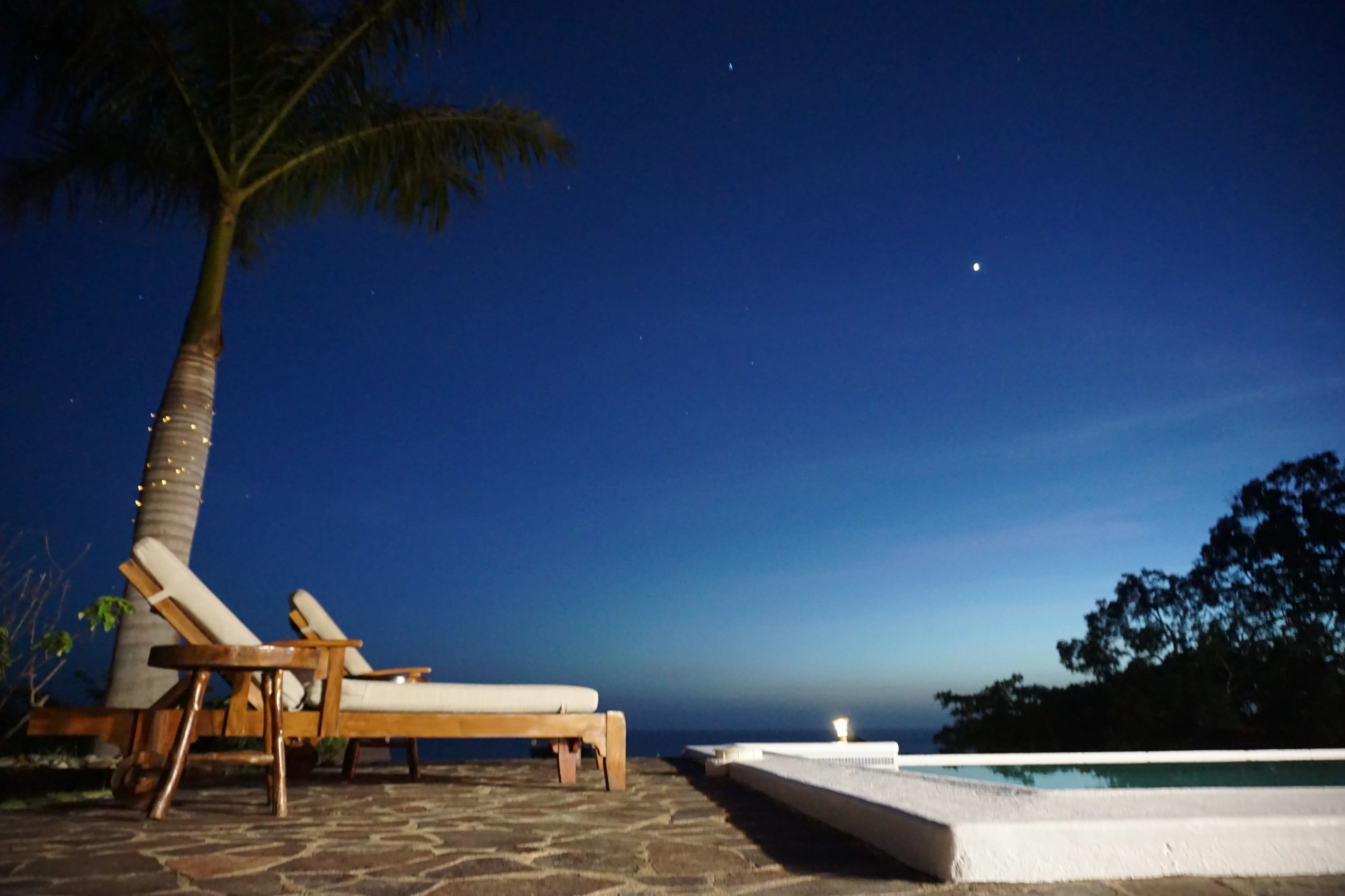 Pool with chairs by nightfall