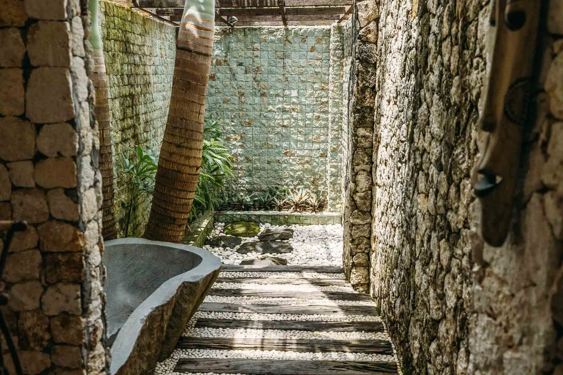 An outdoor bathroom with bathtub with rustic vibes in Bali