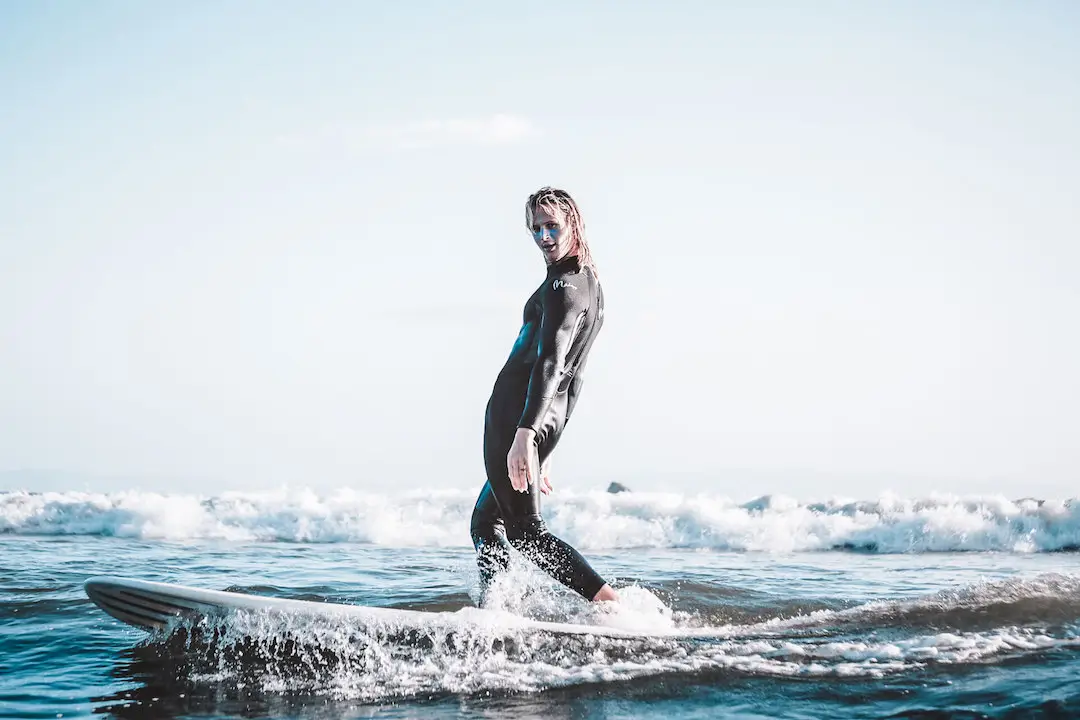 Guy posing on a surfboard