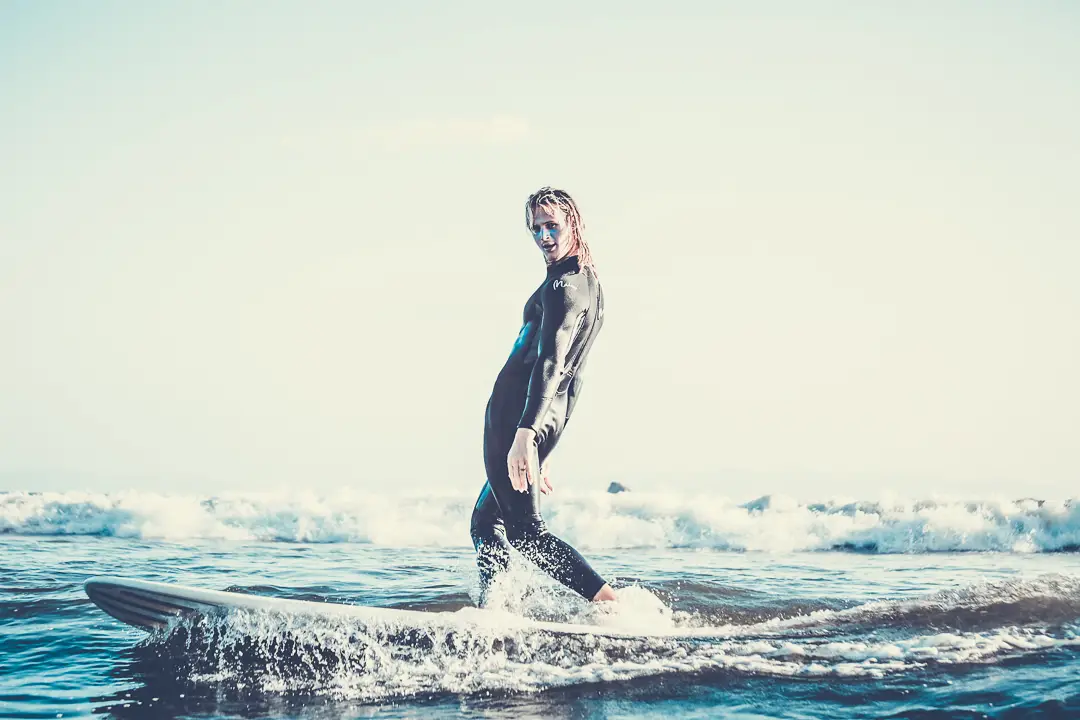 Surfer standing on a surf board