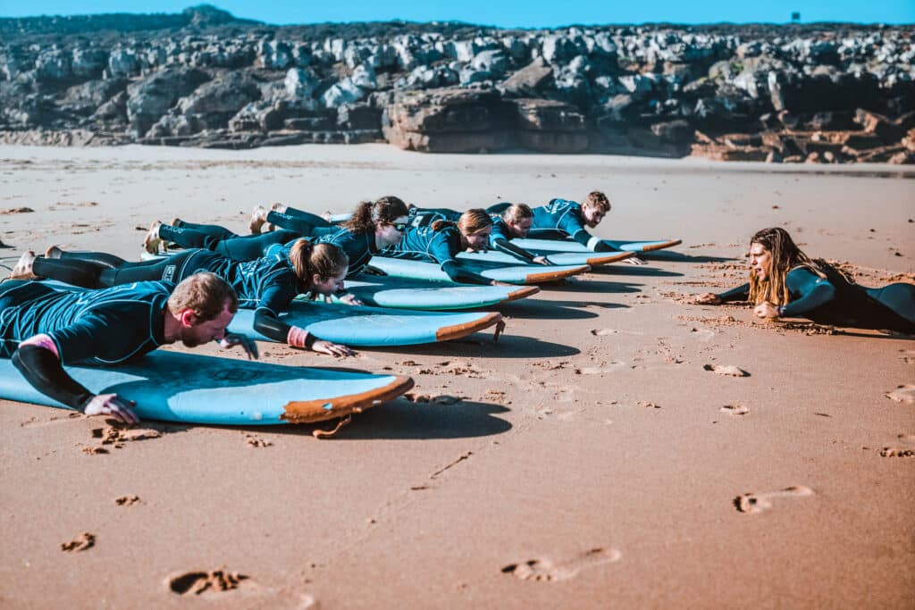 Surf Instructor teaching important surf techniques at the beach