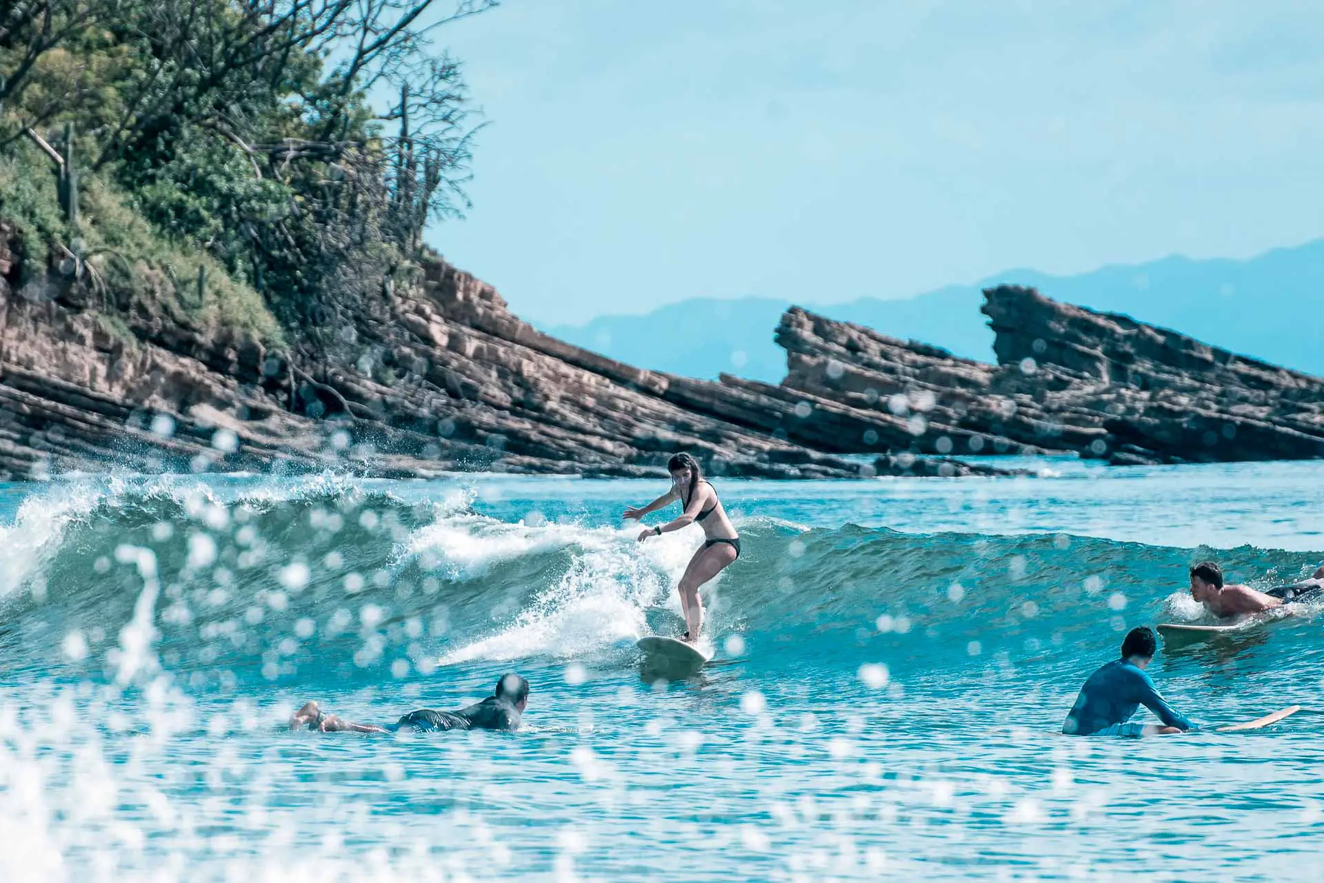 Girl learning to surf with Rapture Surfcamps Nicaragua