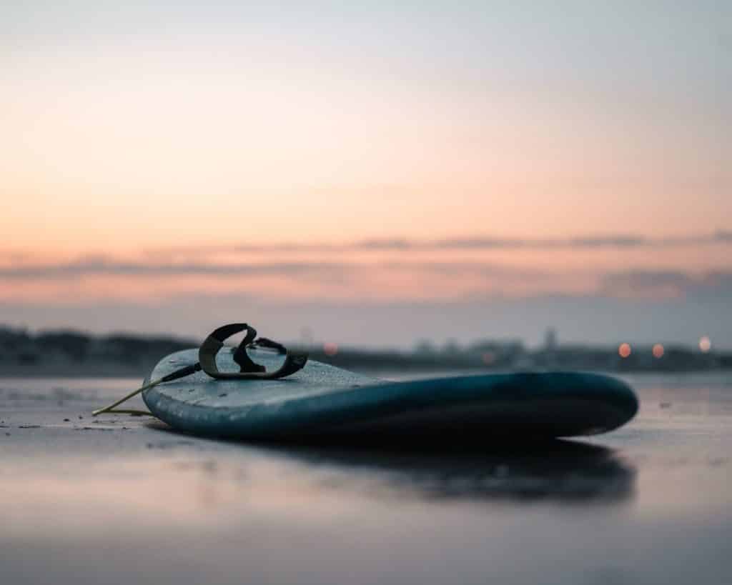 Beginner's surfboard on the beach