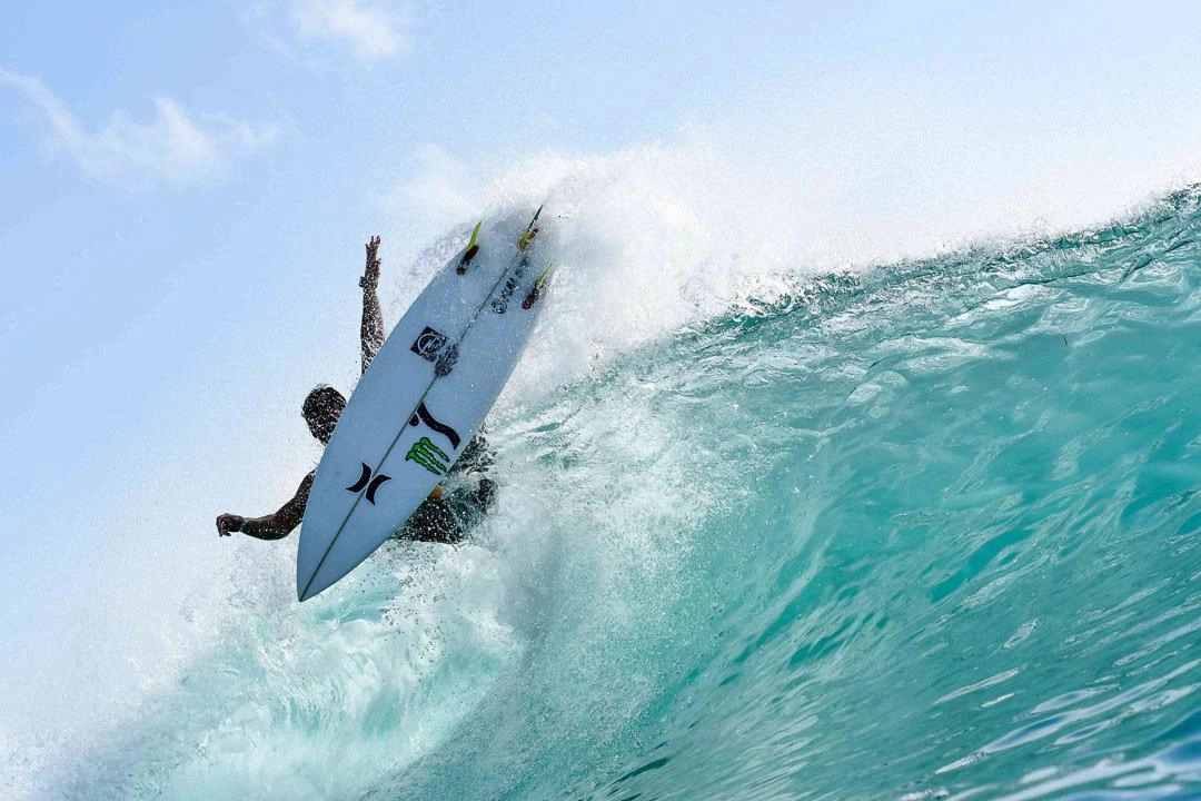 Aerial Surfing move on wave