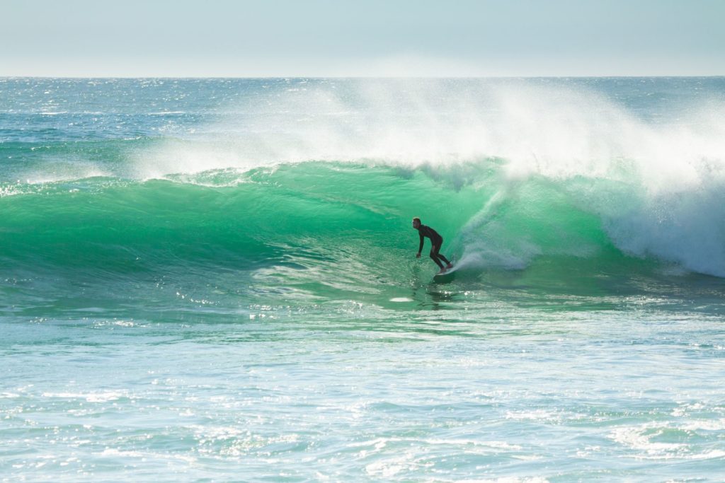 Surfer on a wave in Portugal