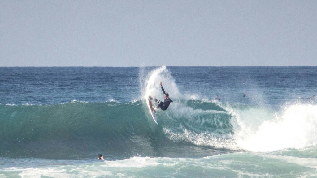 An image of a surfer doing a cutback on a breaking wave