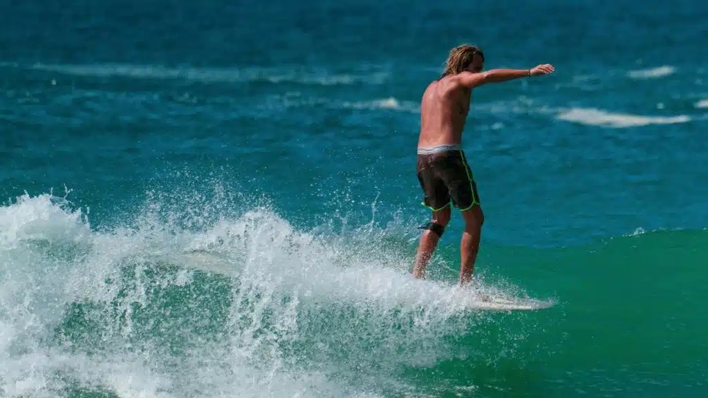 An image of a surfer riding the nose of a longboard