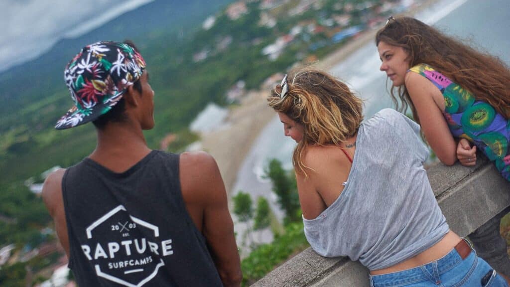 An image of three people over looking the coast in costa rica