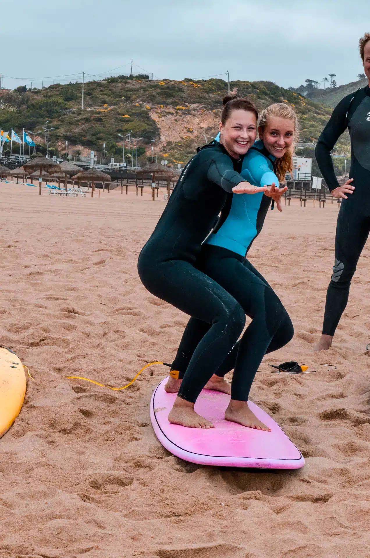 Two people on a surfboard