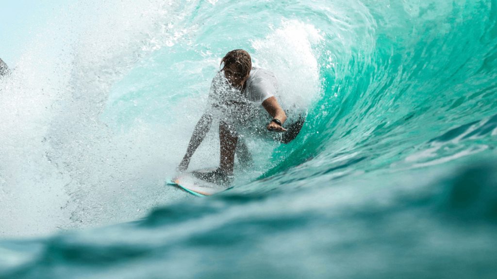 An image of a guy surfing a big wave